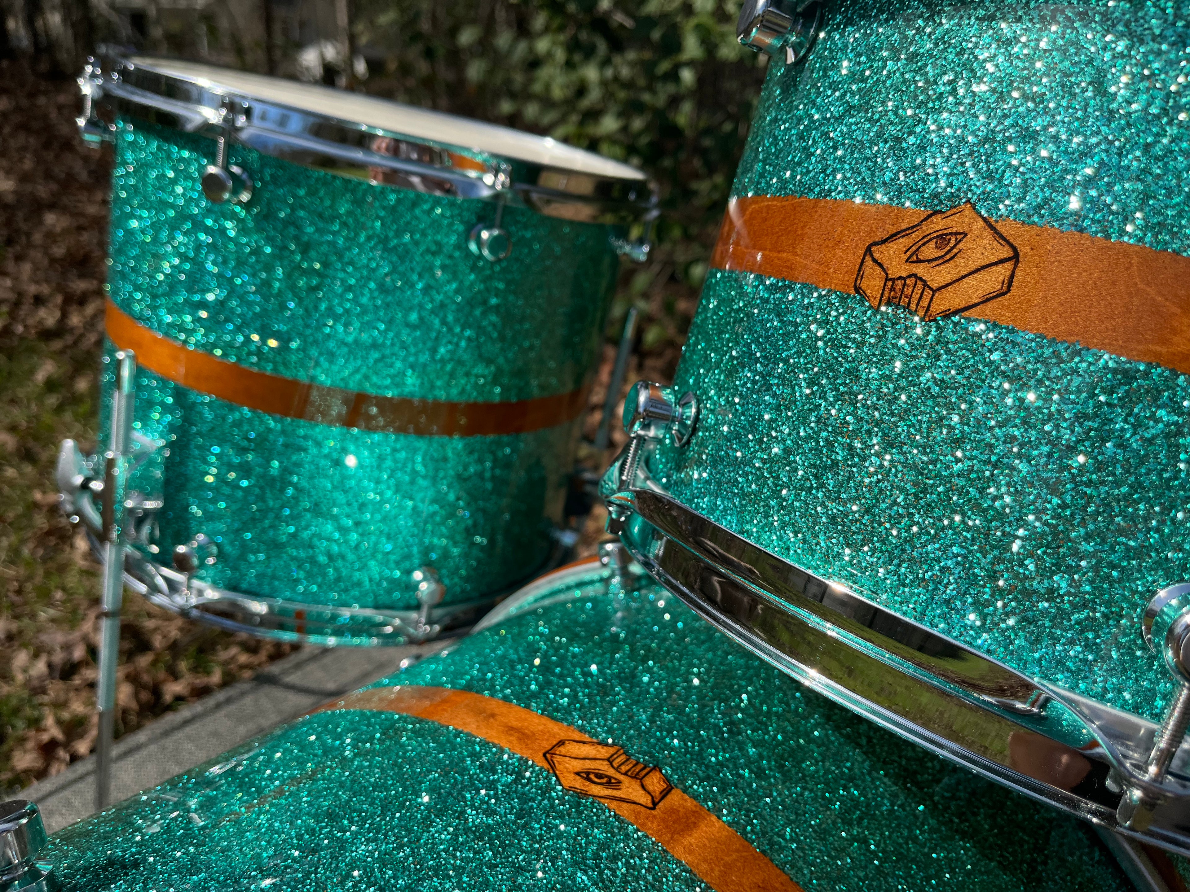 Blue metal flake custom drums with brown stripe