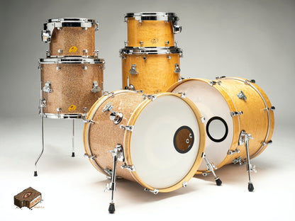 Hand made Nesting Drum Sets shown in a metal flake and a natural maple finish