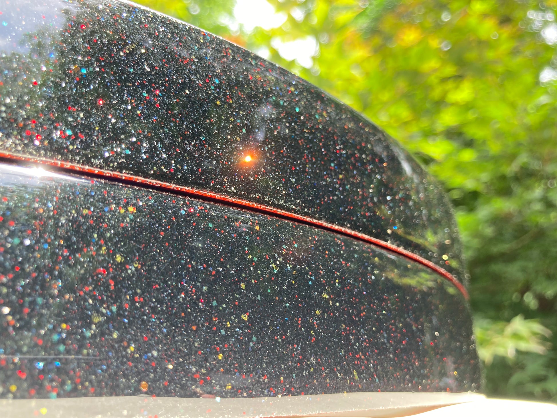 closeup view of a pair of bass drum hoops with a sparkle finish