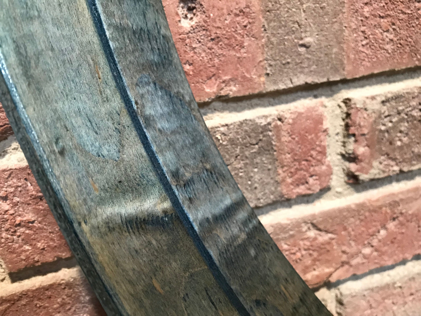 close-up view of a pair of bass drum hoops finished in blue dye