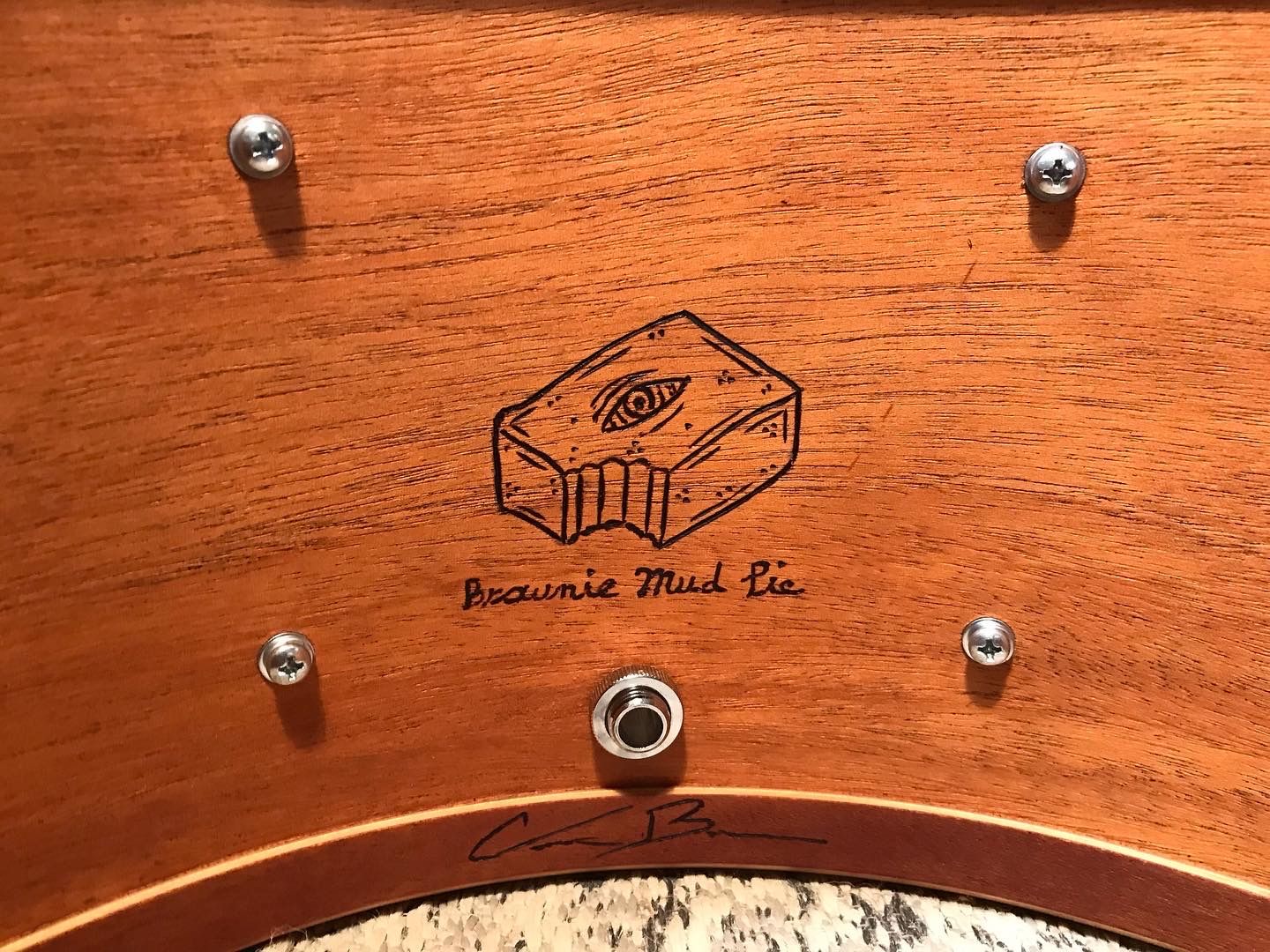 handmade snare drum made of mahogany wood with Brownie Drum Co. logo and caption reading "Brownie Mud Pie"