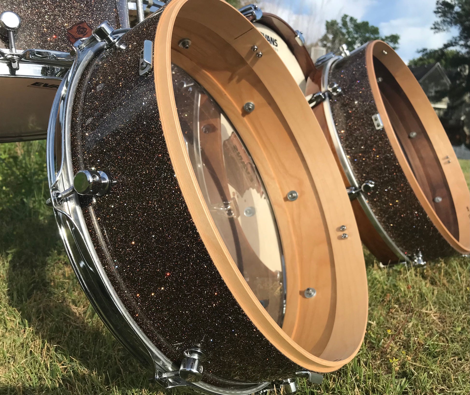 nesting compact drum kit showing two drum shell halves propped on their sides in brown metal flake 