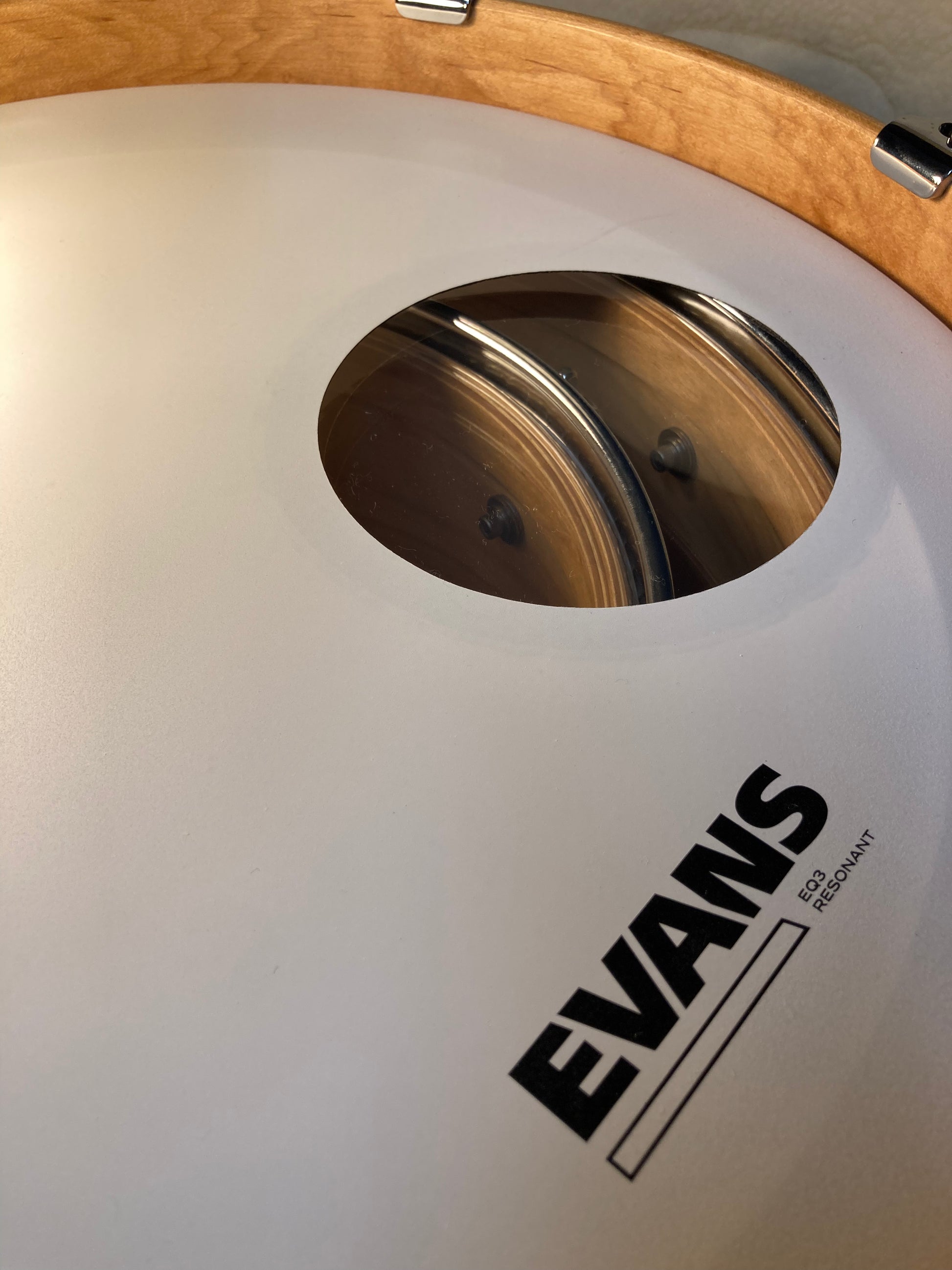 Nesting drums seen through Evans Drum Head