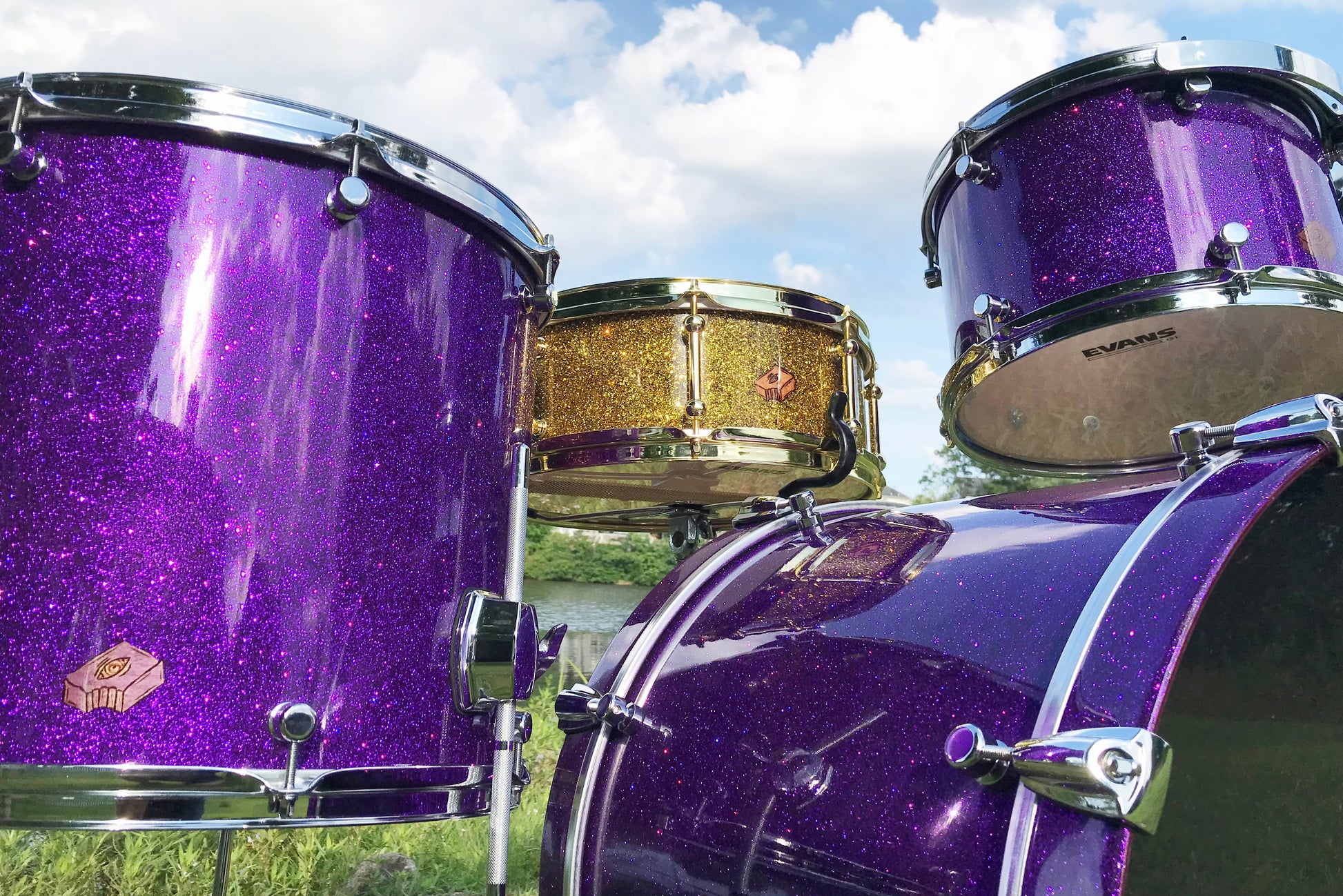 Brownie nesting drum set in purple sparkle with gold sparkle snare in the middle
