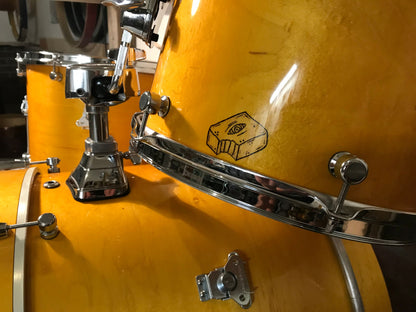 close-up view of a Brownie Drum Co nesting drum set finished in honey amber 