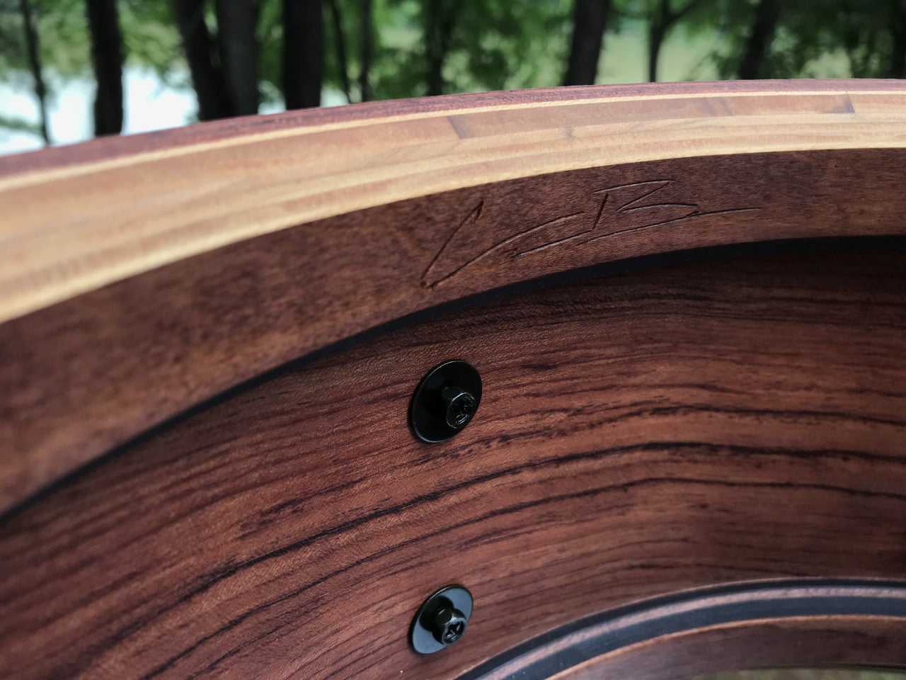interior view of a snare drum shell made of Bubinga wood with Cameron Brown signature