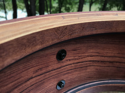 interior view of a snare drum shell made of Bubinga wood with Cameron Brown signature