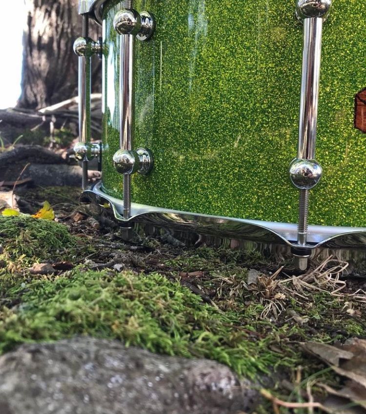 custom snare drum with chrome hardware and green sparkle finish