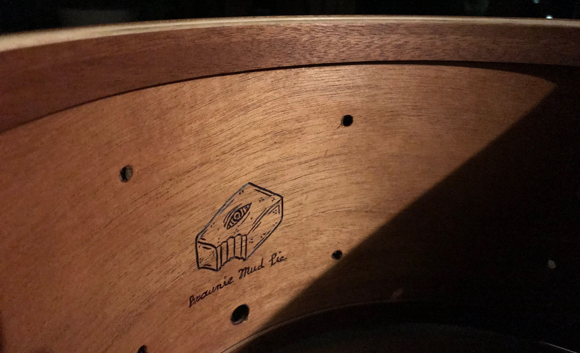 interior of snare drum made of mahogany wood with Brownie Drum Company logo and subtitle reading "brownie mud pie"