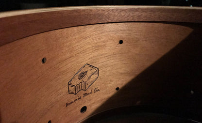 interior of snare drum made of mahogany wood with Brownie Drum Company logo and subtitle reading "brownie mud pie"